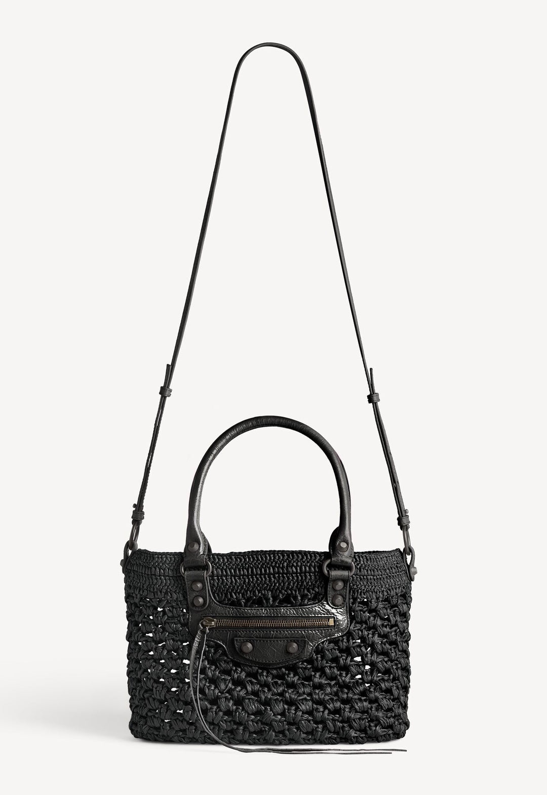 Black woven handbag with a shoulder strap on a white background