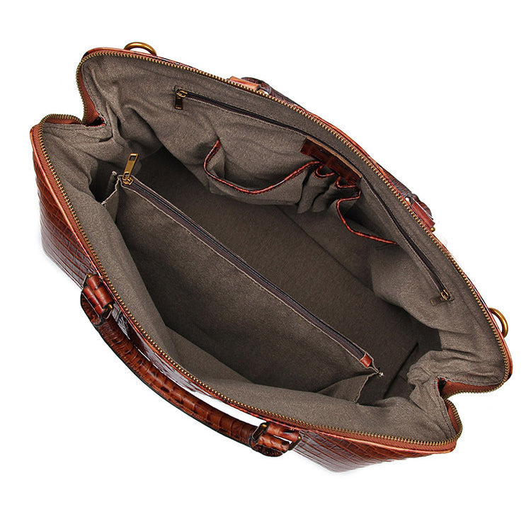 Brown textured leather travel bag with gold hardware