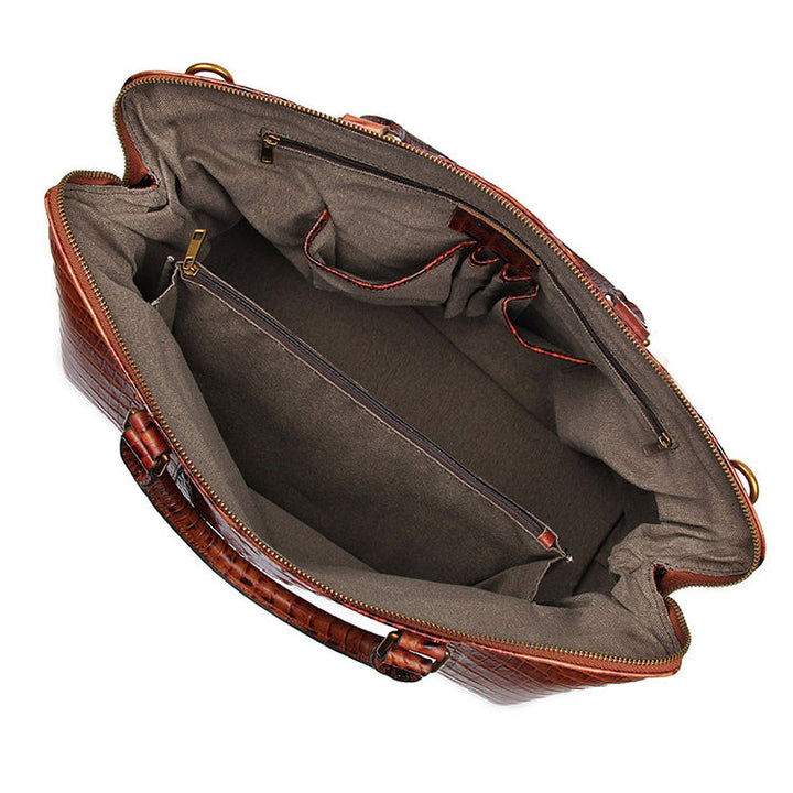Brown textured leather travel bag with gold hardware