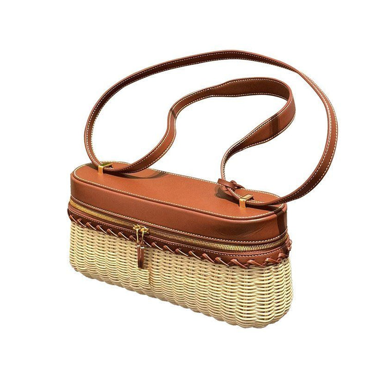 Handwoven bamboo bag with leather trim and gold tone hardware front view