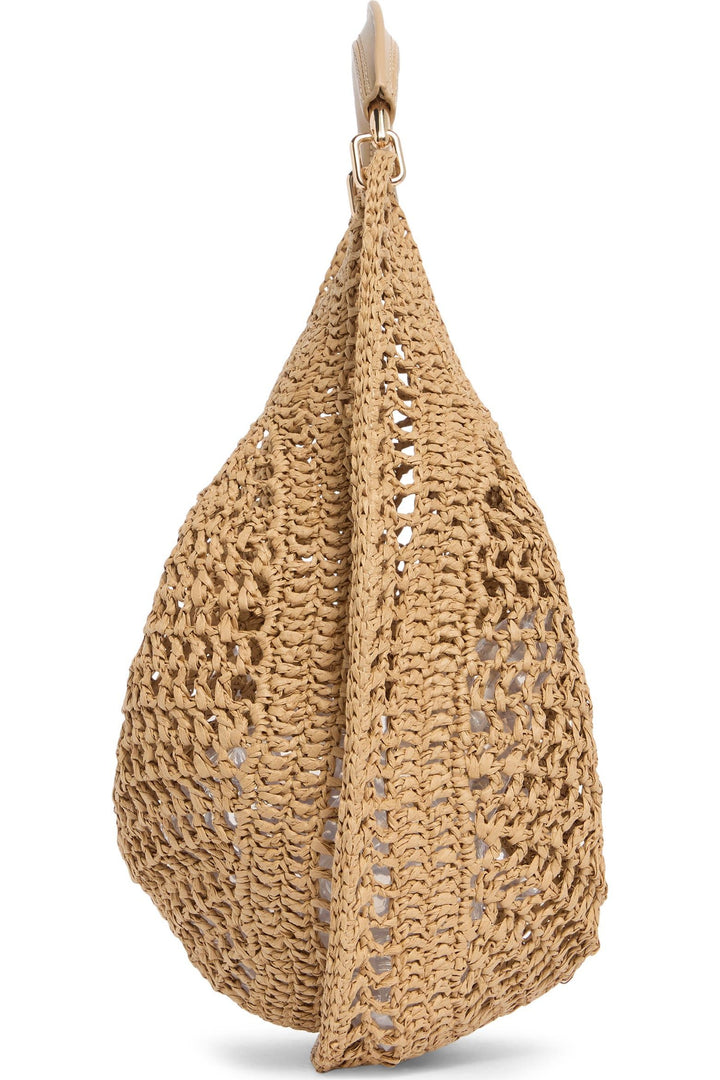 Natural raffia crescent hobo bag showcasing artisanal woven craftsmanship