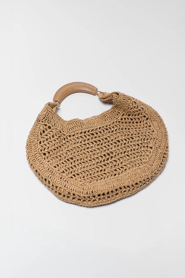 Beige raffia banana bag with oversized curved shape and gold ring hardware
