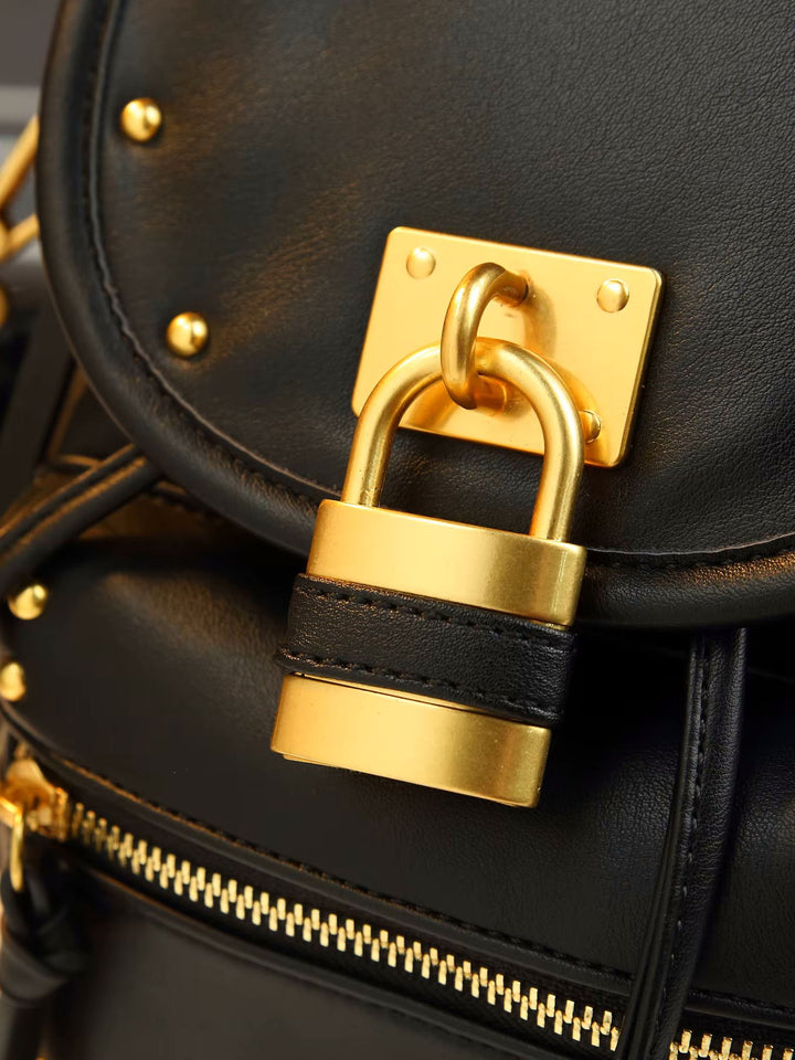 Black leather padlock shoulder bag with gold hardware and front zip pocket