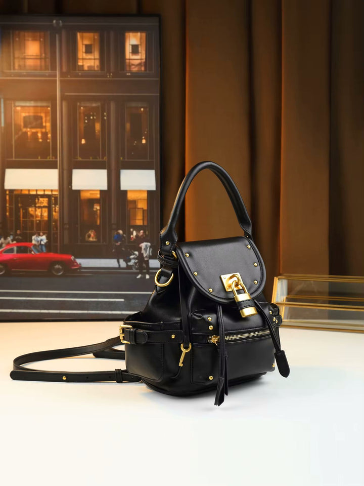 Leather shoulder bag top view showing single rolled top handle and padlock closure detail
