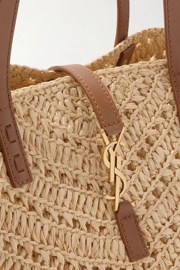 Namrico Panier basket bag front view on grey marble surface showing structured weave
