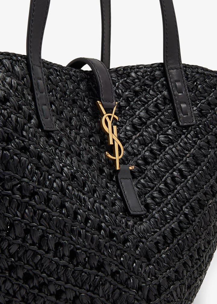 Beige raffia shoulder bag angle view highlighting open crochet pattern texture detail
