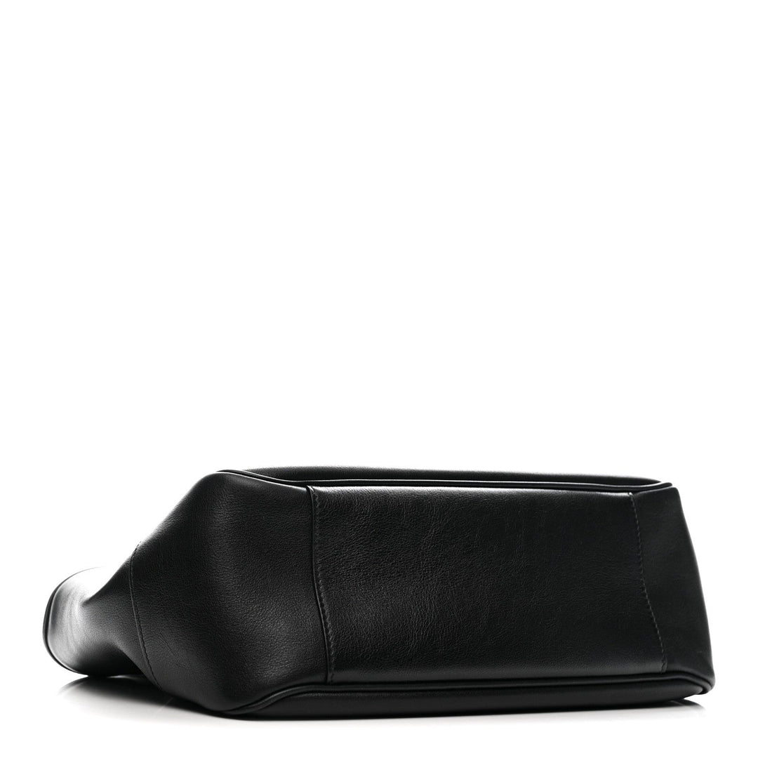Black leather clutch bag on a white background