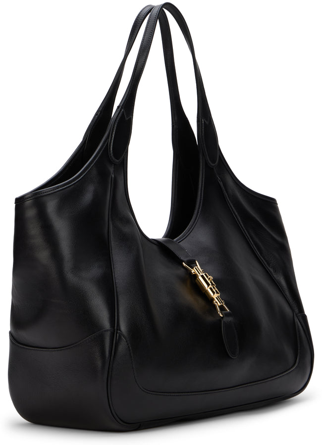 A black leather hobo shoulder bag with a gold-tone YSL logo clasp, photographed on a clean white background.