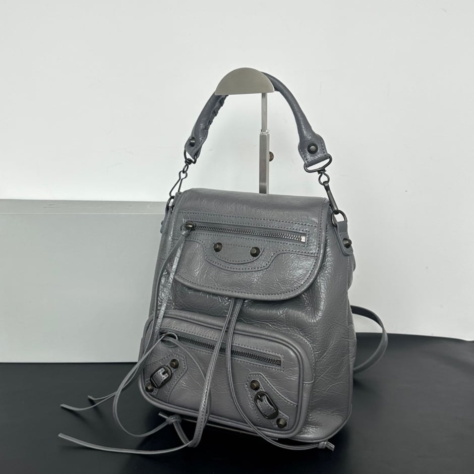 backpack close-up of black stud detailing and drawstring tabs Namrico
