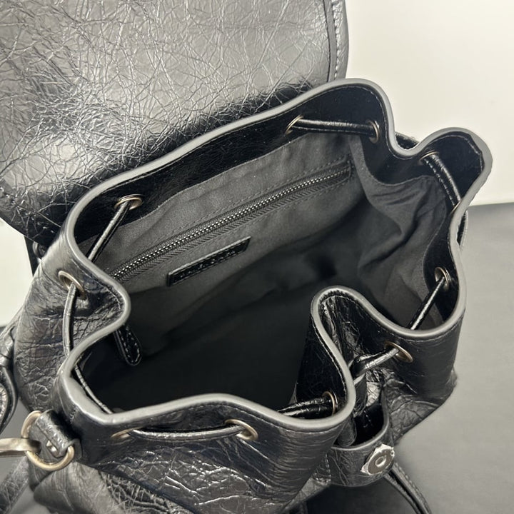 Namrico backpack close-up of black stud detailing and drawstring tabs