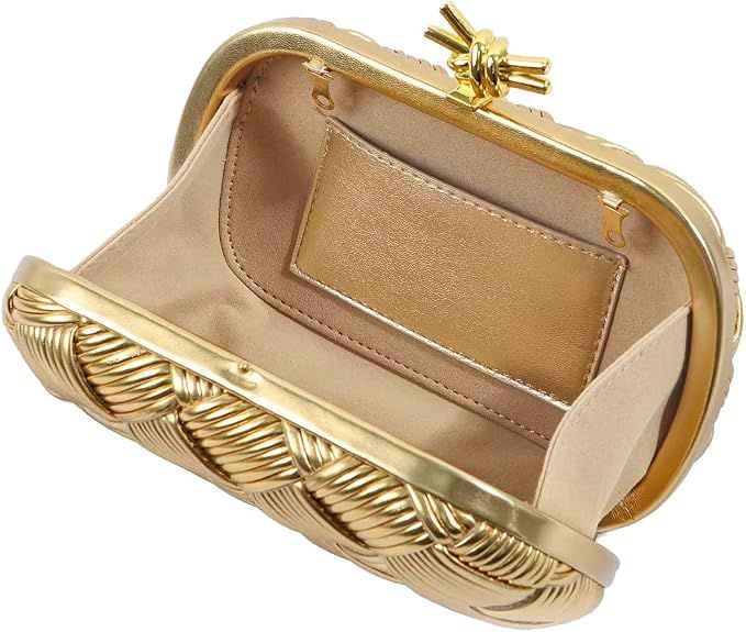 Gold clutch bag with intricate design on a white background
