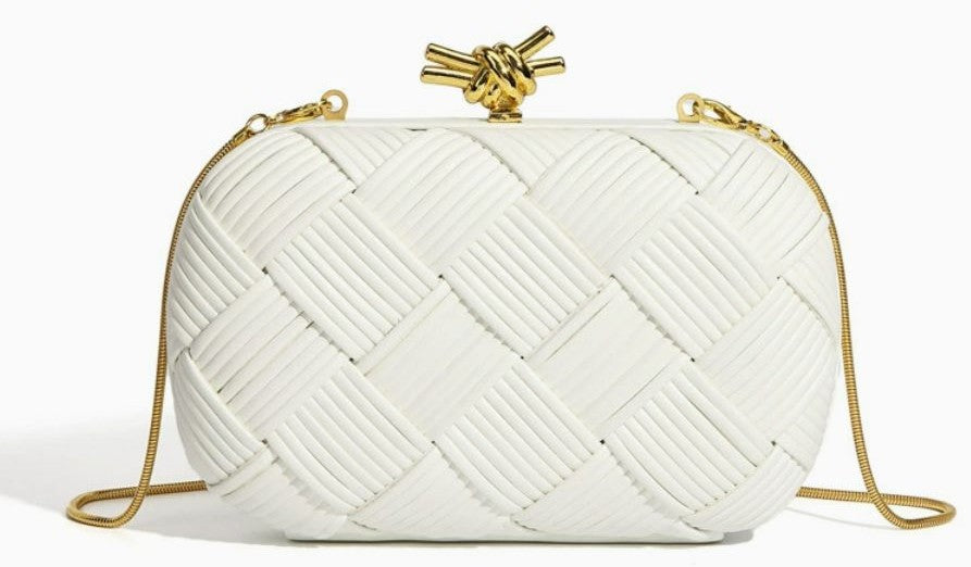 Silver woven evening bag detail shot of gold chain strap and clasp hardware

