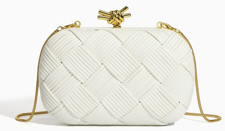 Silver woven evening bag detail shot of gold chain strap and clasp hardware
