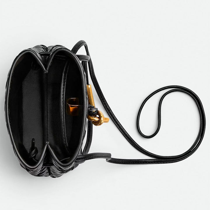 Black intrecciato woven leather phone pouch with gold knot hardware and long crossbody strap