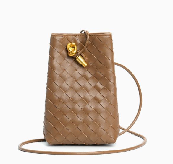 Black woven leather mini bag side view showing depth and structured silhouette