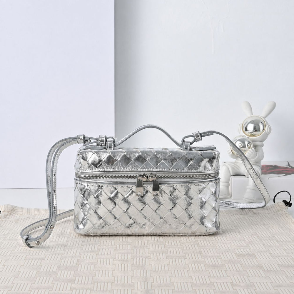 Woven metallic leather vanity bag front view showing diamond weave and gold-tone lock clasp