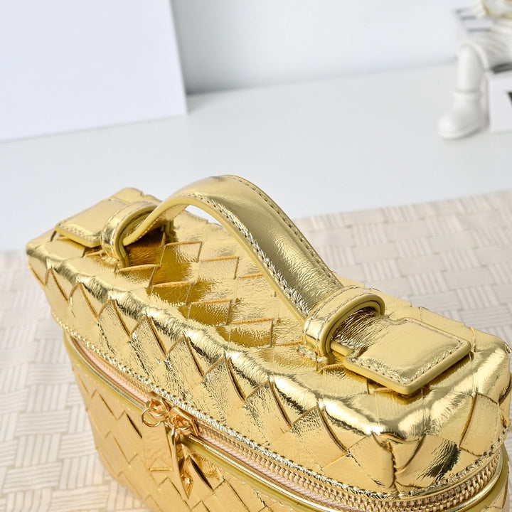 Silver metallic woven leather vanity bag product shot on clean white background