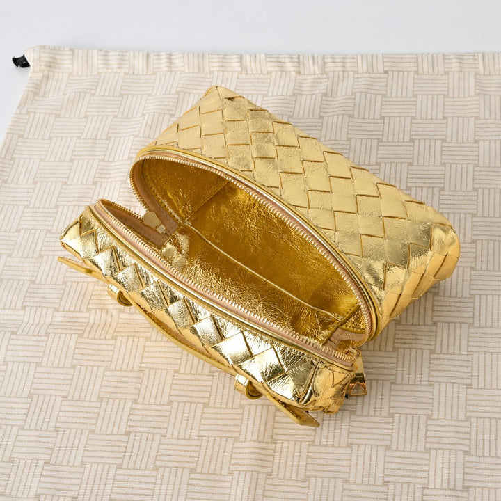 Woven metallic leather bag top view showing zip closure track and top handle attachment